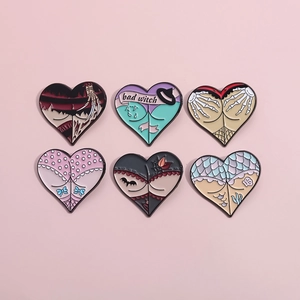Set of six creative heart-shaped enamel pins featuring skull hands and gothic motifs