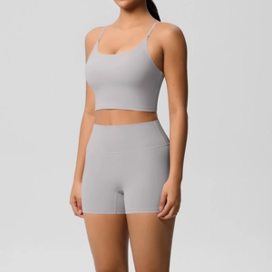 Detail of light grey seamless yoga set with thin straps sports bra and high waist shorts