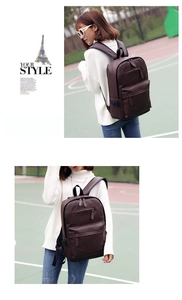 Detailed view of dark brown PU leather backpack with adjustable straps and front pocket