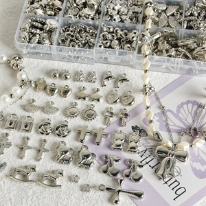 DIY Y2K silver jewelry making kit with various metal charms and storage box