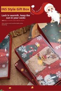 Close-up of a 3-pack Christmas socks gift box with coral fleece and reindeer patterns