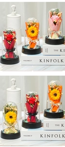 Preserved rose and sunflower in glass dome with LED lights on black base for decor