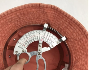 Measuring tool showing 57cm inner circumference of the washed cotton bucket hat