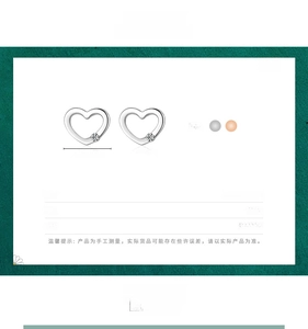 Detailed size specifications of hollow heart silver earrings with 6.3mm by 8.7mm dimensions