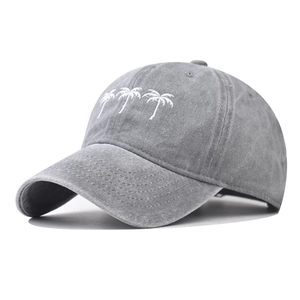 Faded grey washed cotton baseball cap featuring white palm tree embroidery and retro style