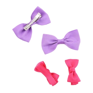 Set of four purple and pink grosgrain ribbon bow hair clips with silver alligator grips