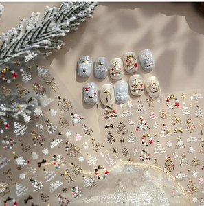 Detail of TL-413 gold embossed Christmas nail stickers with tree and snowflake patterns