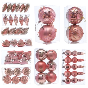 Pink Christmas ball set with star and heart shapes in a decorative box for holiday decor