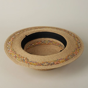 Elegant natural raffia straw hat with colorful woven band and internal sweatband