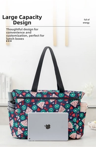 Large fruit print insulated bag showing spacious interior with iPad and water bottle