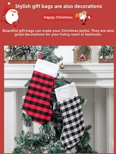 Detailed view of black and white plaid Christmas stockings hanging on a pine tree