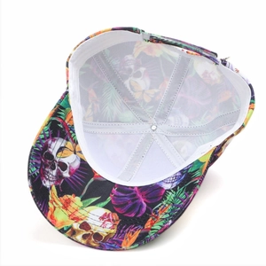 Detail view of the baseball cap's inner lining featuring leaf and skull print patterns