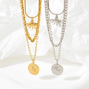 Three-layer stainless steel sun coin necklaces in gold and silver finish on white background