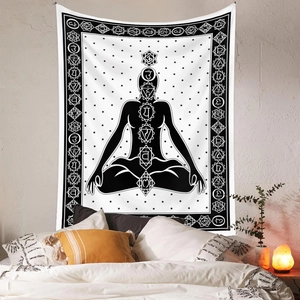 Macro detail of black and white yoga tapestry featuring chakras and starry background