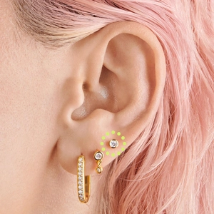Close-up of S925 sterling silver gold stud earring with round bezel-set zircon stone