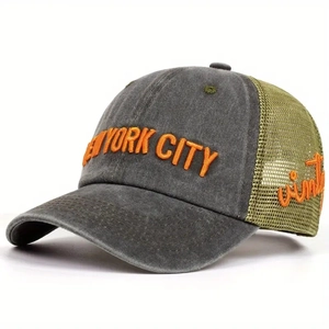 Close-up of vintage trucker hat with orange New York City embroidery and breathable mesh