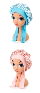 Detail of baby satin sleeping caps with long ties in light blue and pink colors