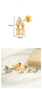 Detail showing gold and silver cartilage studs with cubic zirconia and screw back