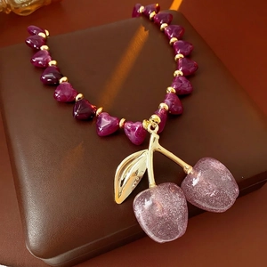 Acrylic purple heart beaded necklace with cherry pendant on luxury jewelry box