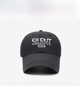 Close-up of white 3D embroidery with SILENT lettering on a black quick-dry baseball cap