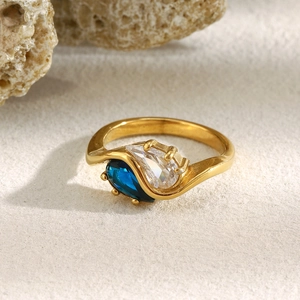 Detail of 18K gold-plated teardrop ring with navy blue and clear zircon stones