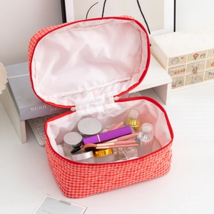 Quilted red checkered makeup bag with zipper closure and large capacity storage for travel