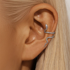 Detailed close-up of a silver snake ear cuff with textured scales for non-pierced ears