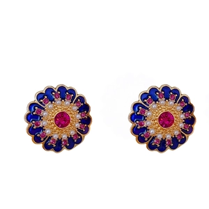 Vintage gold flower earrings with blue enamel, pink gem, and pearls on white background