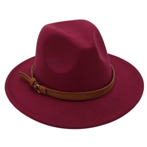 Detail of burgundy fedora hat with brown leather band and metal buckle accessory