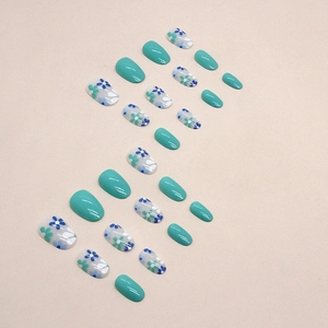 Oval sage green press-on nails set with cute floral patterns for summer manicure