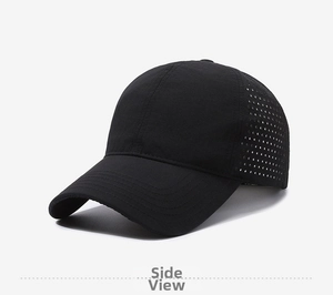 Detail view showing laser-perforated breathable holes on black quick-dry baseball cap