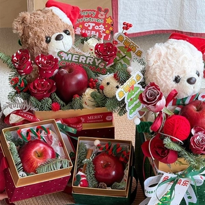 Christmas gift box set with plush bear, roses, and festive pine cones in elegant packaging
