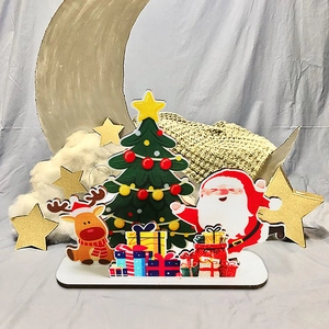 Handcrafted wooden Christmas centerpiece featuring Santa Claus, reindeer and a festive tree