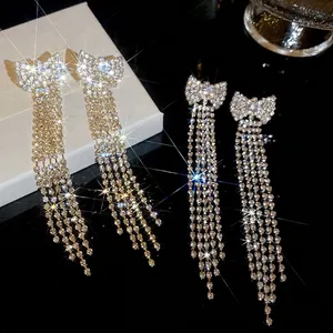 Elegant silver bow long tassel drop earrings with sparkling cubic zirconia stones