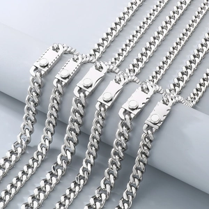Detail of silver stainless steel Cuban link necklaces with modern rectangular clasps