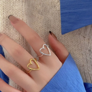 Minimalist 925 sterling silver heart open rings in gold and silver finish on hand