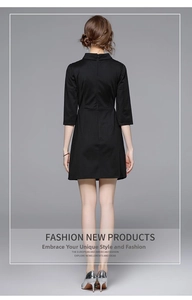 Back view of a black tailored dress with turn-down collar and three-quarter sleeves