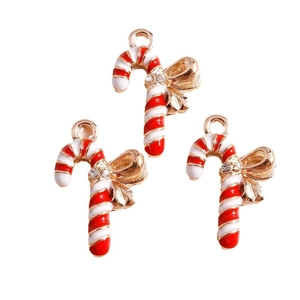 Set of 3 Christmas candy cane pendants with red enamel, gold bow, and rhinestones