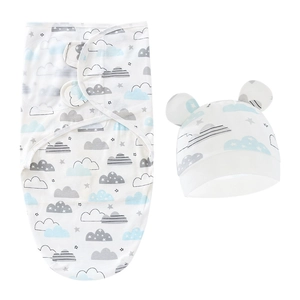 Newborn swaddle wrap and hat set with blue cloud and star patterns on white cotton