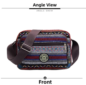 Front angle show of ethnic style striped canvas tote bag with woven geometric patterns