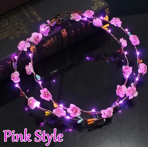 Close-up of pink rose LED flower crown with purple lights and battery control box