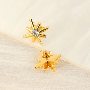 French vintage gold starburst stud earrings with central zircon and butterfly back
