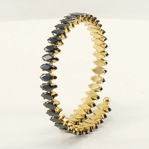Adjustable 18K gold stainless steel spiral bracelet with marquise black gemstones