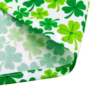 Detailed view of Saint Patrick's Day pet bandana featuring clover print and edge stitching