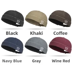 Detailed view of brimless dockers caps in six colors with embroidered crown logos