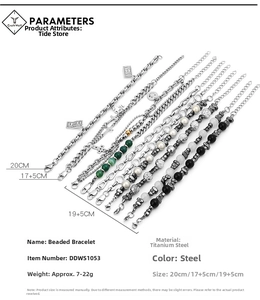 Detailed view of titanium steel beaded bracelets with diverse charms and chain styles