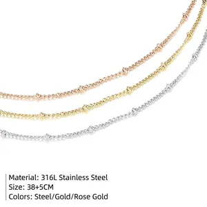 Three-color layered stainless steel chain necklaces set in silver, gold, and rose gold