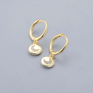Close-up of gold plated S925 silver hoop earrings with crescent moon zircon pendant