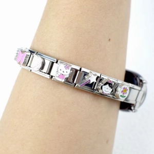 Detail of silver modular bracelet watch with Hello Kitty charms and colorful enamel icons