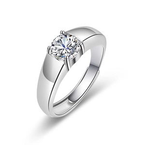 Macro view of classic men's silver ring with round-cut zircon in a four-prong setting